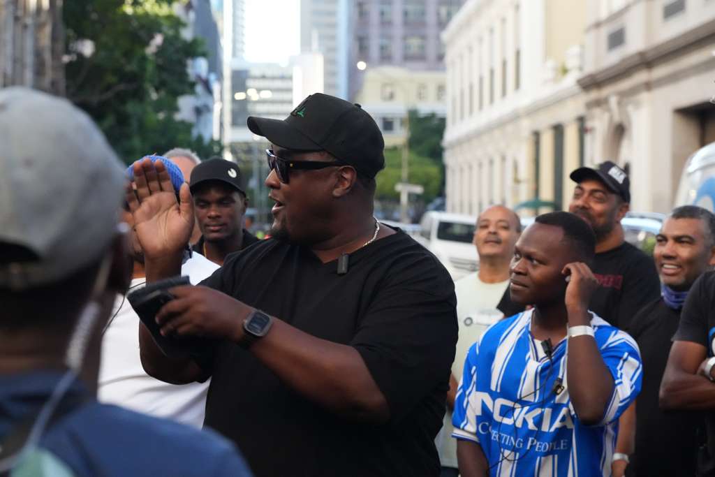 Director briefing the crew on a city location
