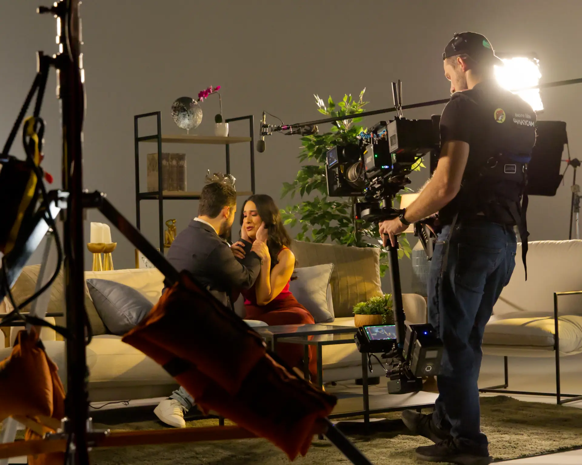 Steadicam operator filming an intimate living room scene