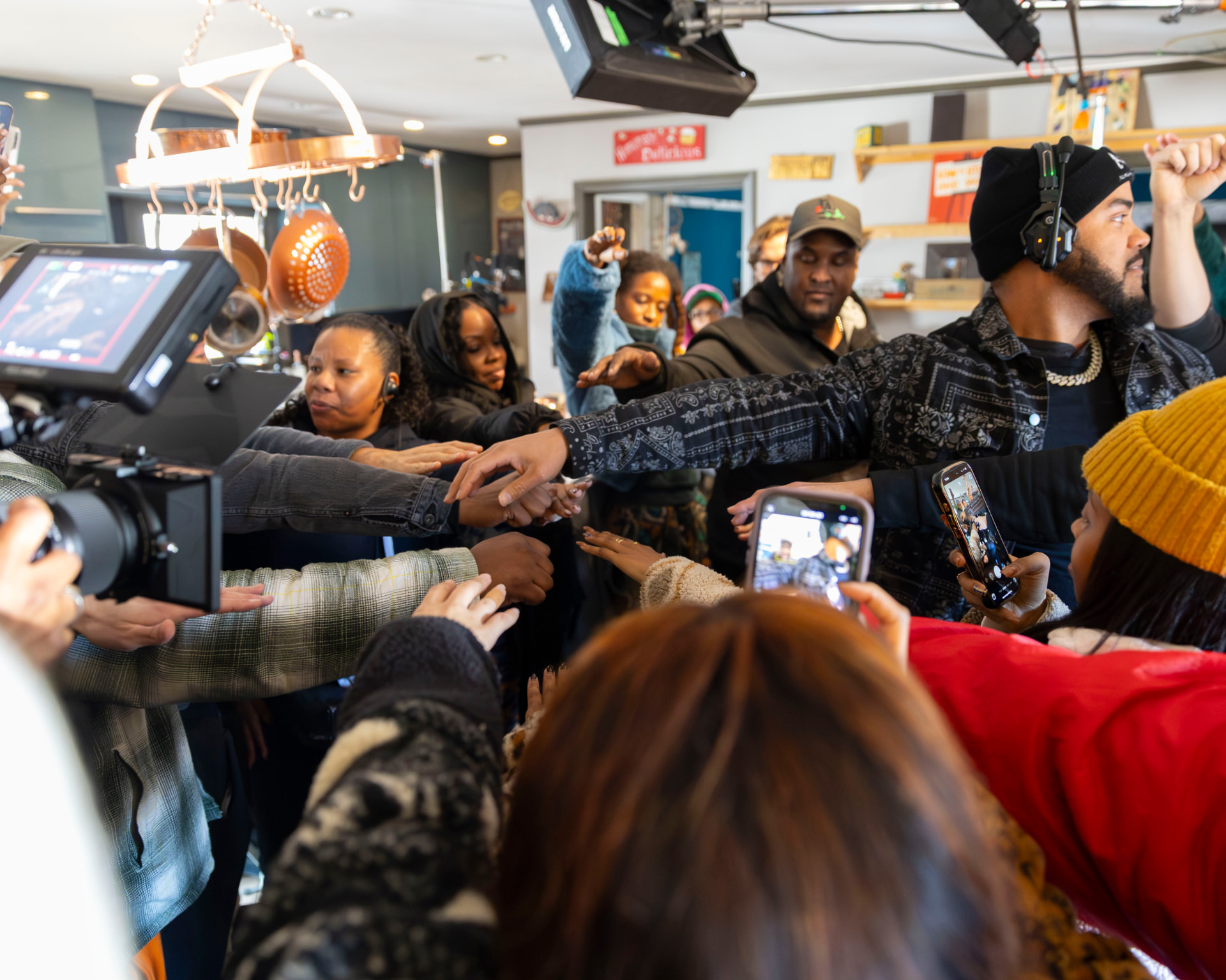 Crowd scene being filmed with cast and crew
