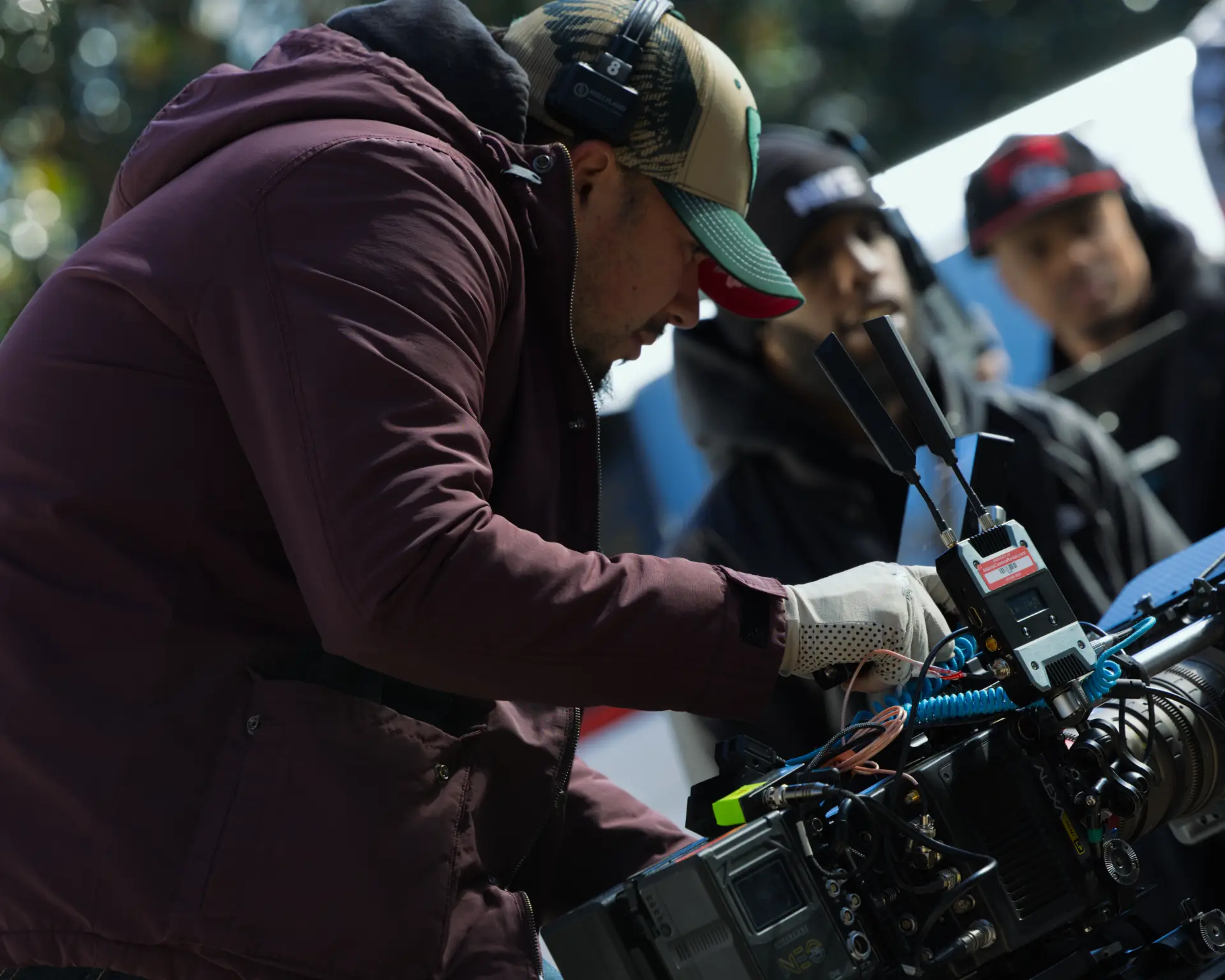 Assistant camera adjusting the rig between takes