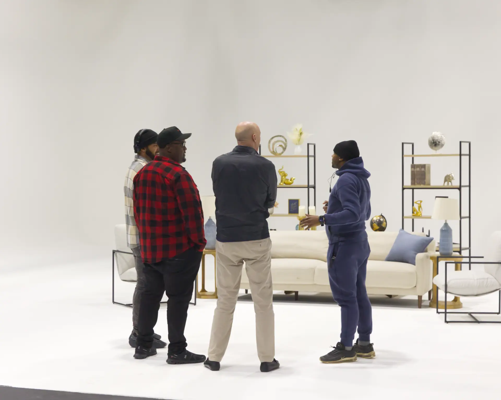 Crew blocking a scene on a white cyc studio set